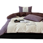 Reversible bedding set with contrasting inserts and fine line embroidery