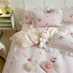 Playful cotton bedding set with ruffles and appliqués