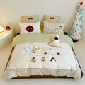Children's bedding set with appliquéd winter figures and checkered ruffle