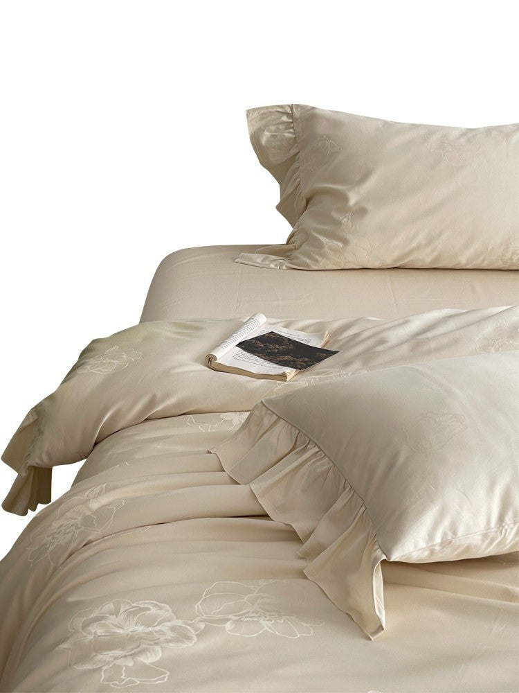 Bedding set made of cotton satin with ruffle, subtle jacquard floral relief and silky-matt finish