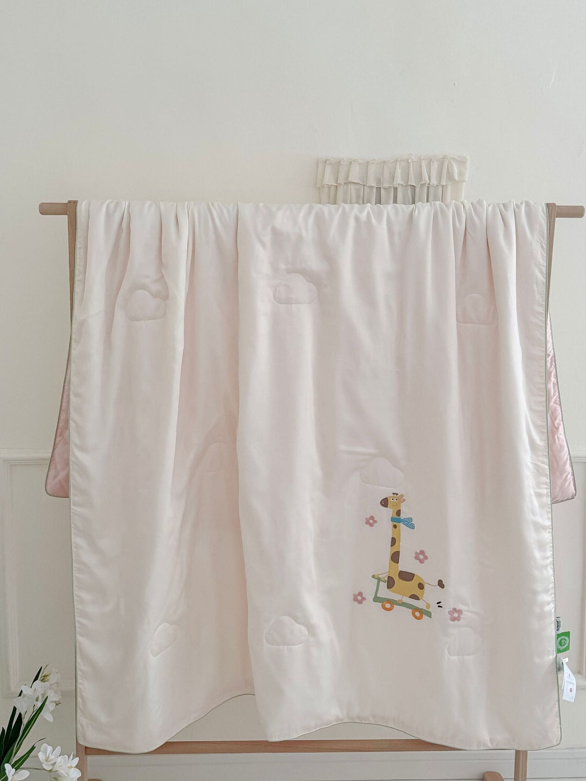 Children's comfort quilt with sweet bunny embroidery and silky satin cover