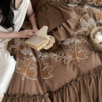 Bedding set with embroidered leaf pattern, ruffled bed skirt and ruffled pillow