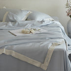 Elegant satin bedding set with silky touch, contrasting border and concealed closure