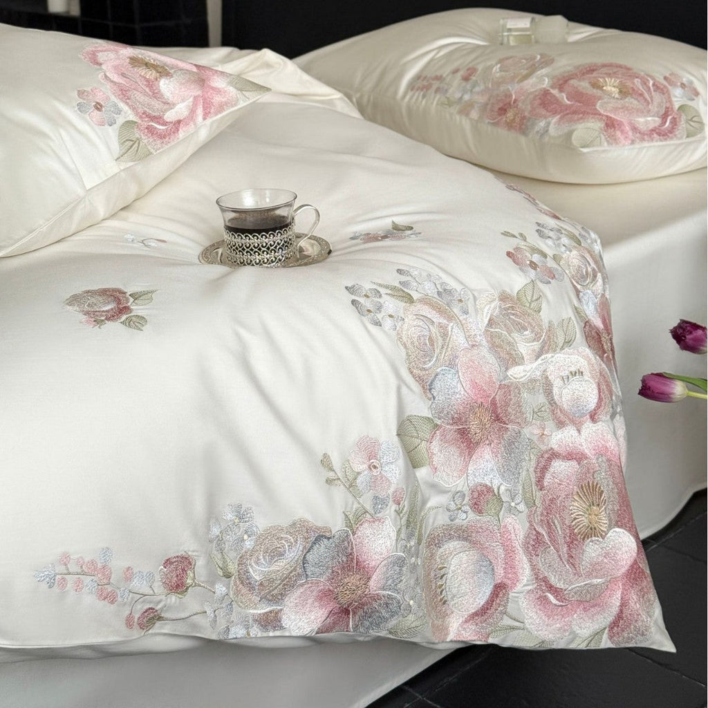 Embroidered satin bedding set with floral relief embroidery and silky finish