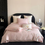Embroidered satin bedding set with floral relief embroidery and silky finish