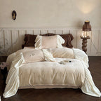 Satin bedding set with gathered ruffles and delicate butterfly embroidery