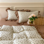 Romantic bed linen complete set made of cotton percale with delicate floral print, ruffle trim, and silky-matte finish