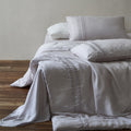 Linen bedding set with stonewash finish and delicate ruffle inserts