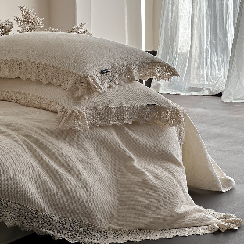 Bedding set with crocheted lace trim and linen look