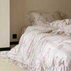Luxurious satin bedding set with delicate rose pattern and ruffled hem
