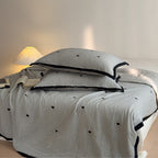 Quilted cotton bedspread set with heart motif and contrasting piping Bowlift
