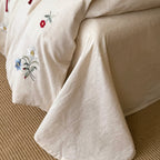 Bedding set made of linen look with floral embroidery and bow closure