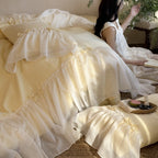 Bedding set with ruffled bed skirt, ruffle cushion and bow application