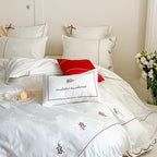 Bedding set with fine embroidery and contrasting piping