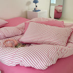 Striped cotton percale bedding set with contrasting decorative piping