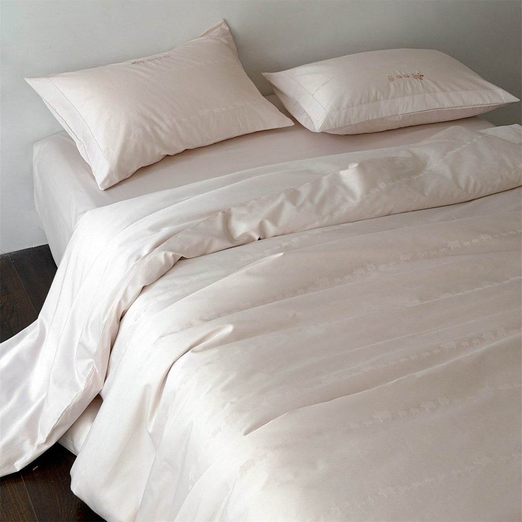 Finely woven cotton bedding set with embroidered animal border