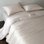 Finely woven cotton bedding set with embroidered animal border