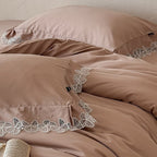 Luxurious cotton satin bed linen set with fine lace border