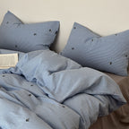Bedding set made of breathable cotton percale with fine pinstripes and embroidered panda motifs