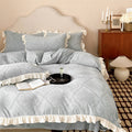 Bedding set with delicate ruffle trim and Jacquard damask structure