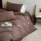 Embroidered bed linen set made of cotton satin with subtle scattered flower embroidery