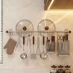 Wall mount made of stainless steel with hooks for kitchen utensils