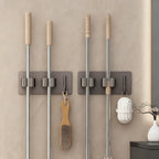 Stainless steel holder for mop and broom