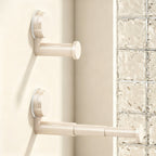 Telescopic clothes rail with suction cup